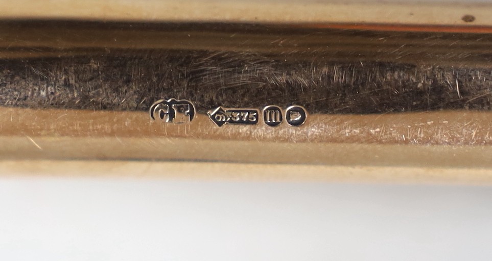 An Edwardian 9ct gold mounted ebonised baton, with presentation inscription to Mr. W.J. Bunny', maker Charles Edwards, London, 1908, 49.4cm.